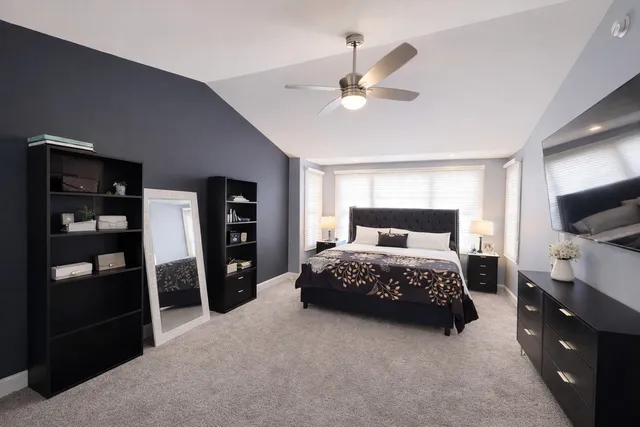 a bedroom with a bed and a walk in closet