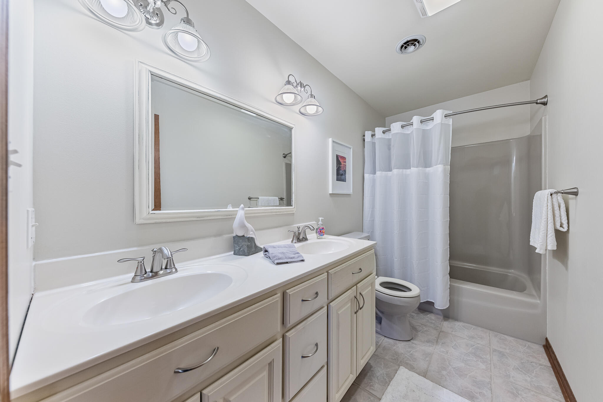 13161 Stateline Road Cedar Lake, IN 46303 - Photo 12 of 30 a bathroom with a sink a toilet a mirror a vanity and shower