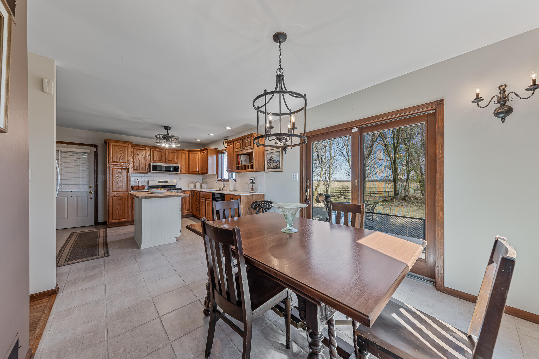 13161 Stateline Road Cedar Lake, IN 46303 - Photo 6 of 30 a view of a dining room with furniture window and wooden floor
