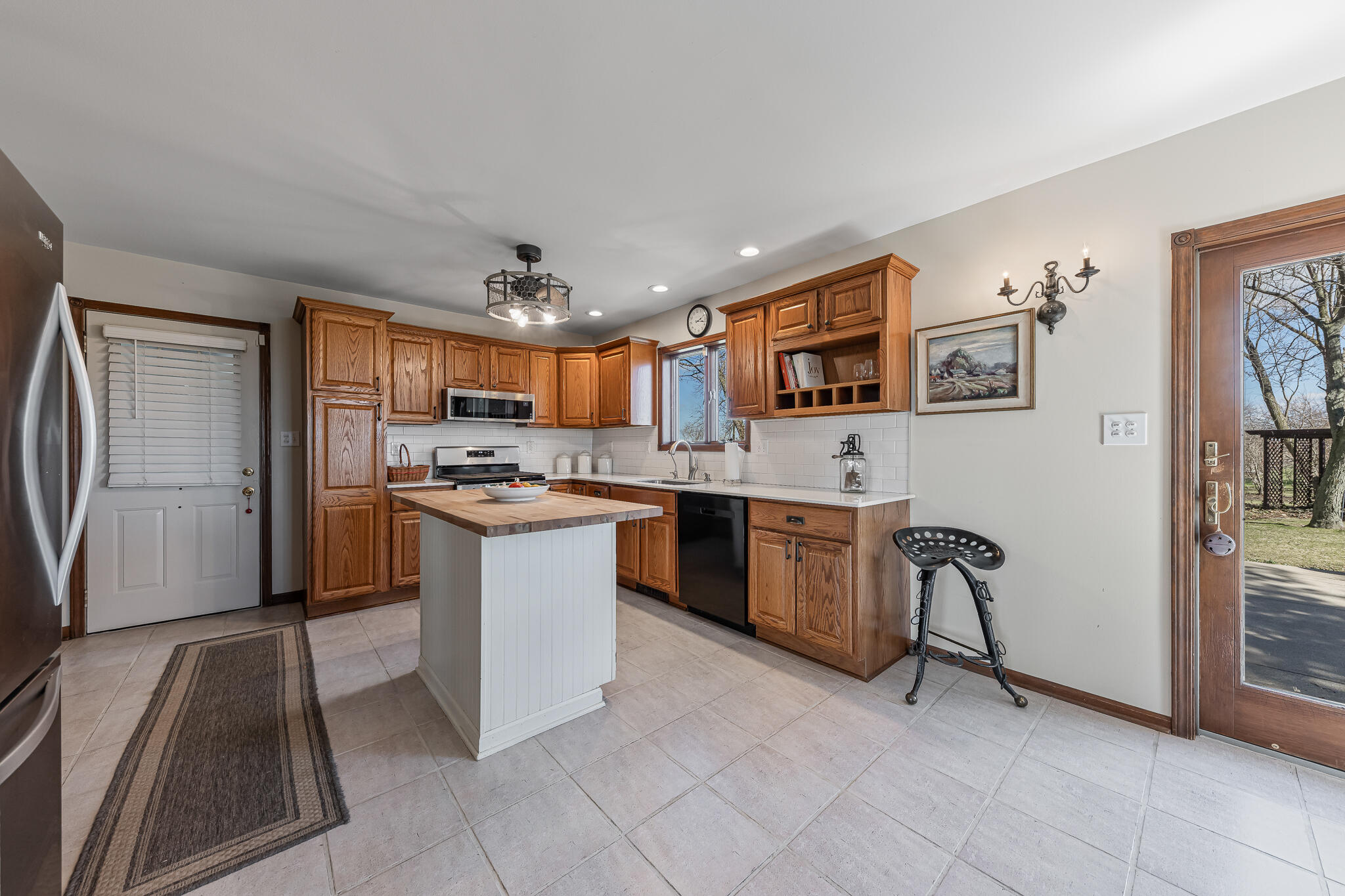 13161 Stateline Road Cedar Lake, IN 46303 - Photo 7 of 30 a kitchen with stainless steel appliances granite countertop a refrigerator and a stove top oven