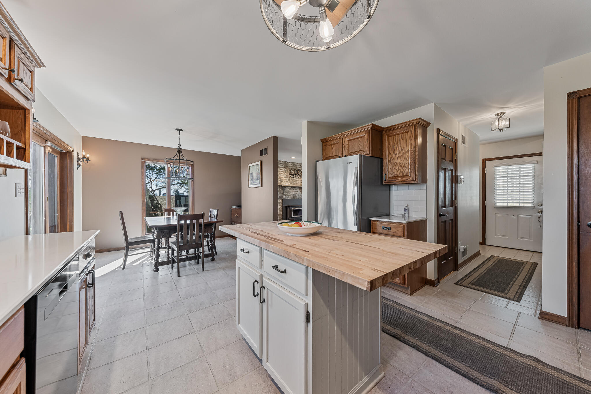 13161 Stateline Road Cedar Lake, IN 46303 - Photo 8 of 30 a kitchen with a stove a refrigerator and a dining table