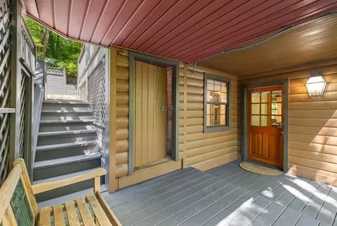 a view of front door with wooden floor and door