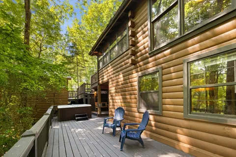 a view of balcony with wooden floor and outdoor seating