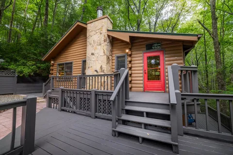 a view of backyard with deck and wooden floor