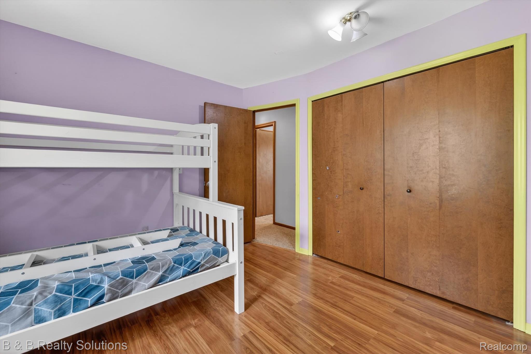 2467 North Lake George Road Metamora, MI 48455 - Photo 28 of 46 Bedroom with light wood-type flooring and a closet