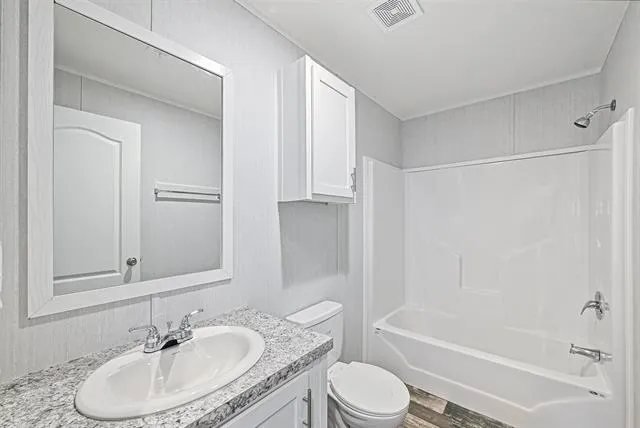 a view of a room with a wooden floor and window