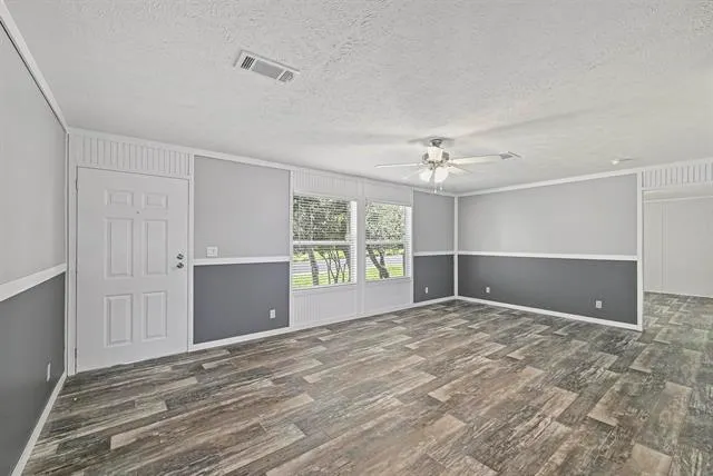 a view of an empty room with a window