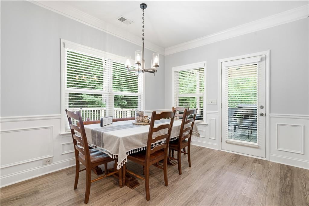 302 Spence Circle Ball Ground, GA 30107 - Photo 21 of 55 a view of a dining room with furniture window and wooden floor