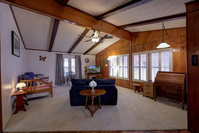 a open kitchen with stainless steel appliances granite countertop a stove and a refrigerator