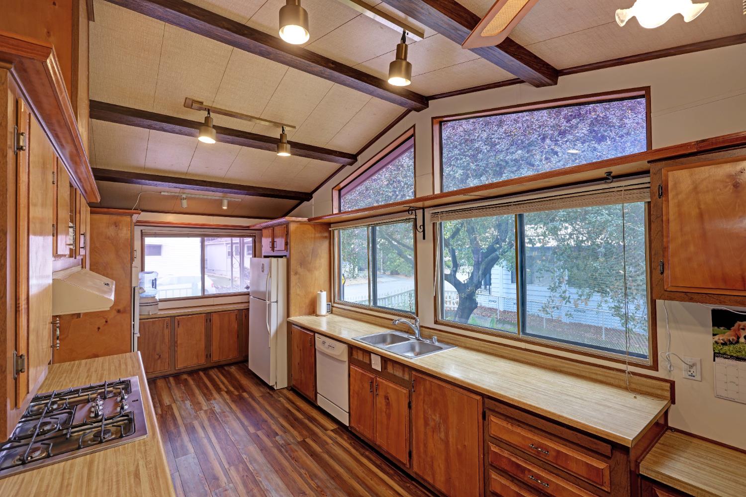 3765 Grass Valley Highway, Unit 263 Auburn, CA 95602 - Photo 18 of 38 a kitchen with wooden floors and a sink