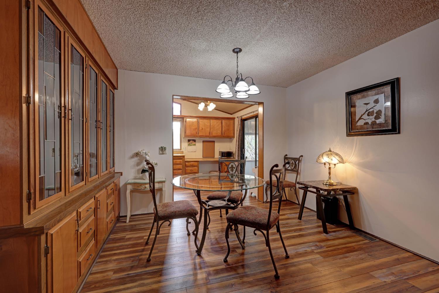 3765 Grass Valley Highway, Unit 263 Auburn, CA 95602 - Photo 19 of 38 a view of a dining room with furniture window and wooden floor