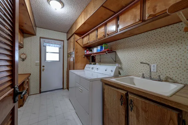 a view of an entryway with a cabinet