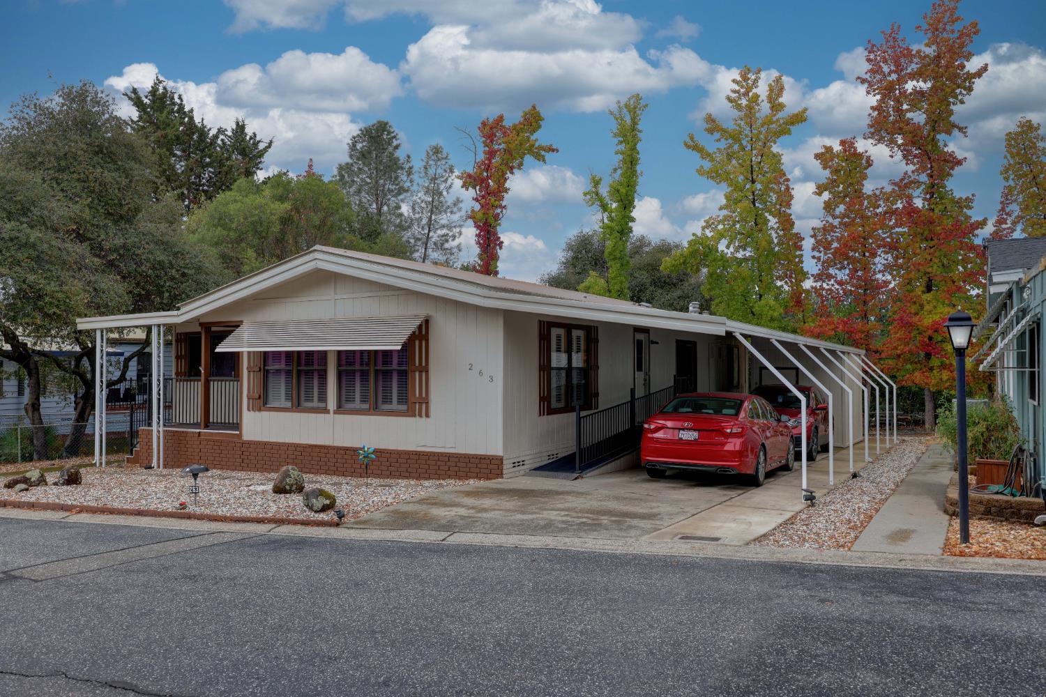 3765 Grass Valley Highway, Unit 263 Auburn, CA 95602 - Photo 3 of 38 a front view of a house with a garden