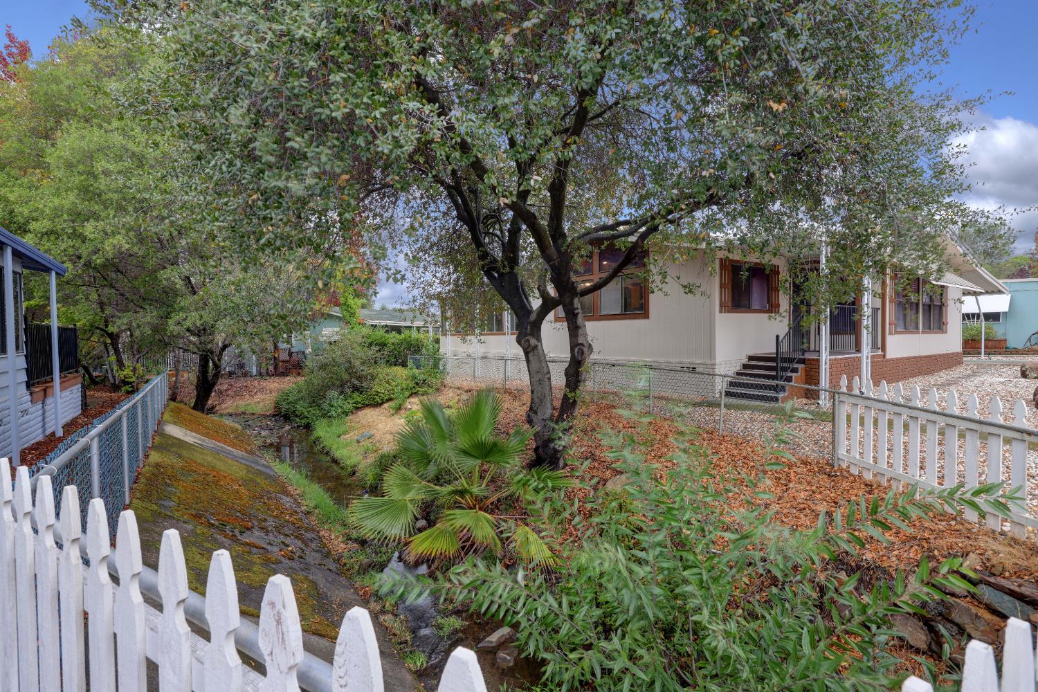 3765 Grass Valley Highway, Unit 263 Auburn, CA 95602 - Photo 4 of 38 a view of a house with wooden fence