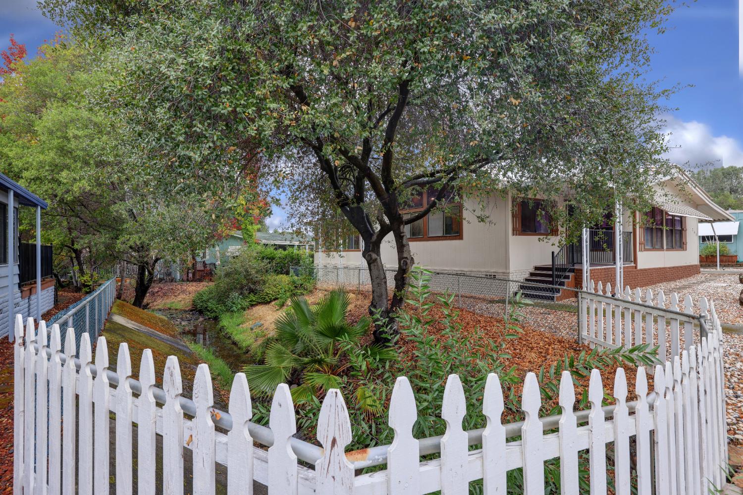 3765 Grass Valley Highway, Unit 263 Auburn, CA 95602 - Photo 6 of 38 a view of a house with wooden fence