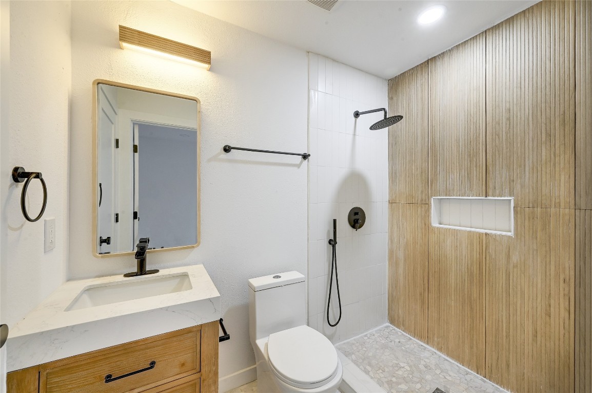 2404 Santa Rita Street Austin, TX 78702 - Photo 13 of 27 Full bath with walk in shower and vanity