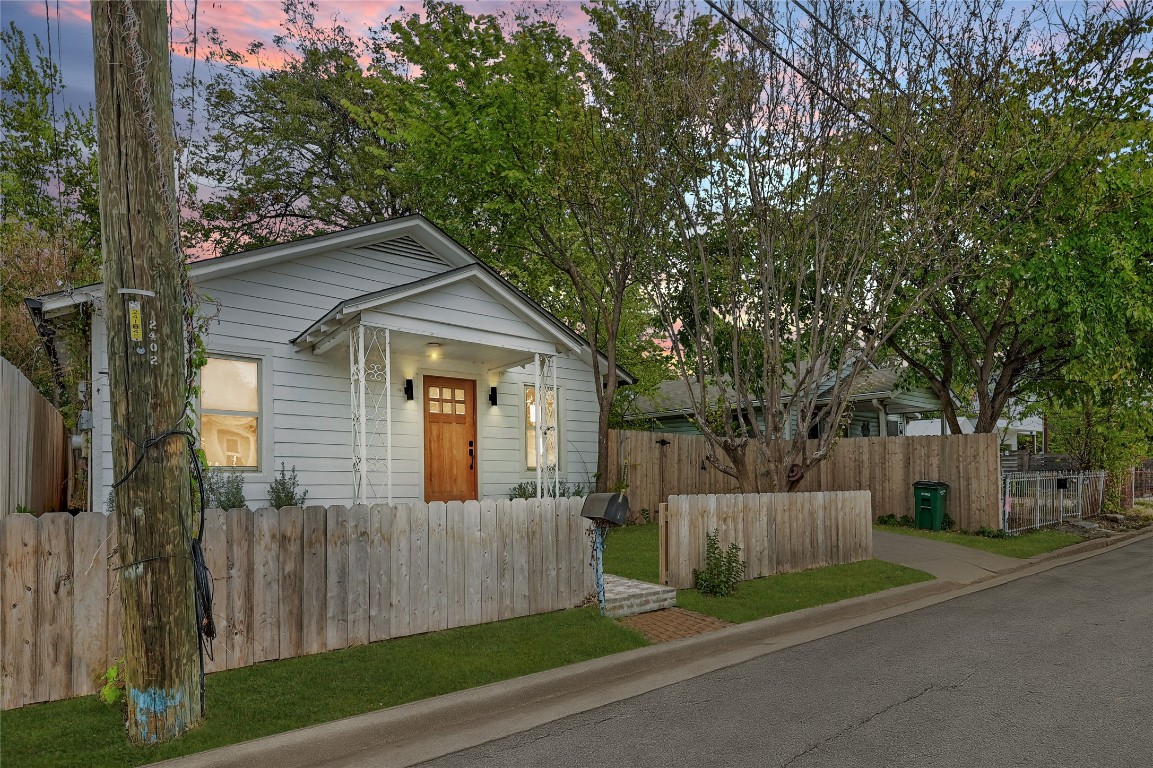 2404 Santa Rita Street Austin, TX 78702 - Photo 2 of 27 View of front of property featuring a fenced front yard