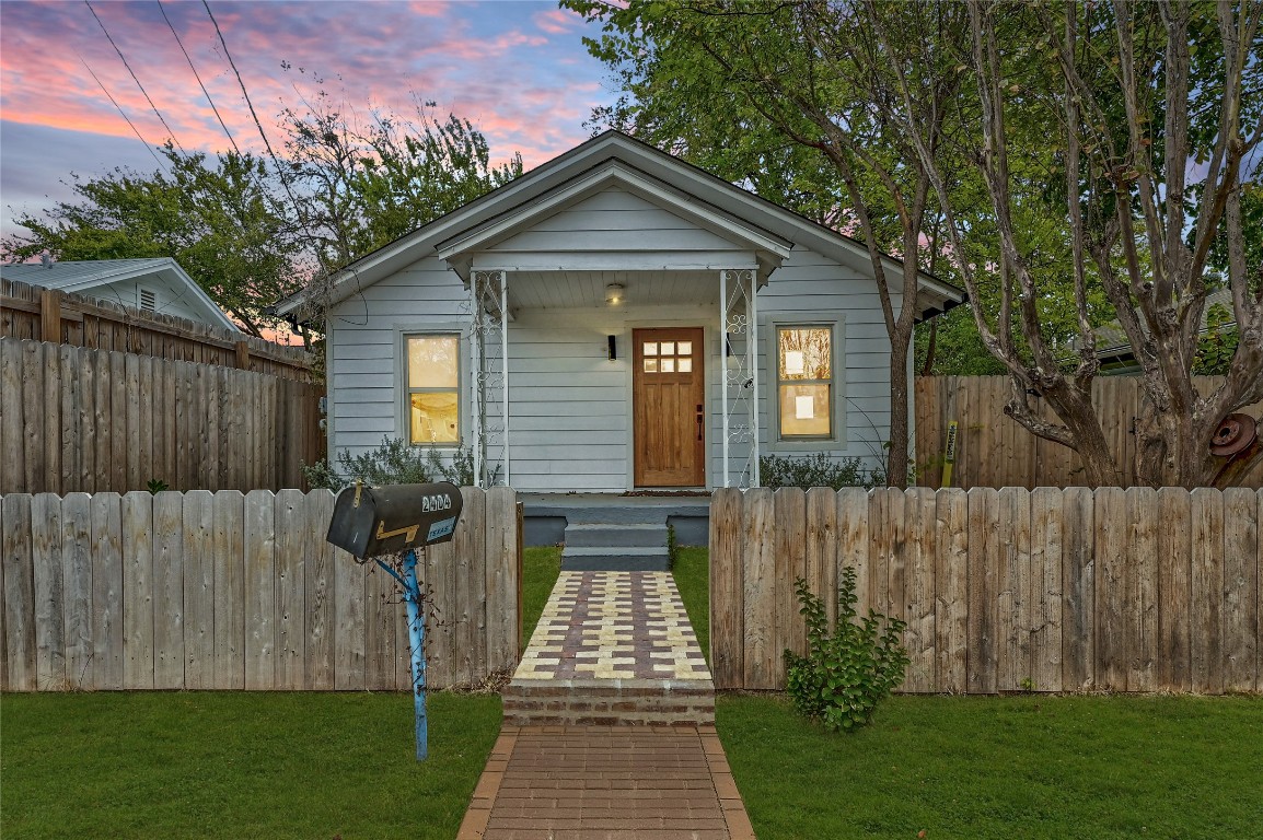 2404 Santa Rita Street Austin, TX 78702 - Photo 3 of 27 View of front facade featuring a fenced front yard and a porch