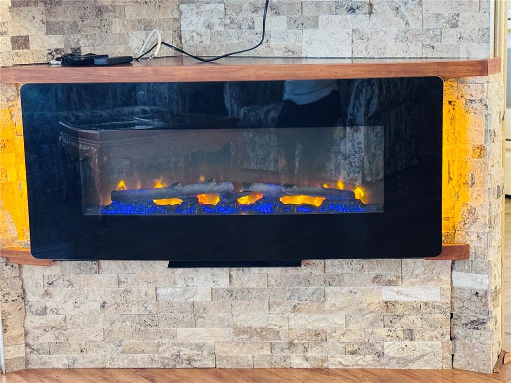 2331 Belleair Road, Unit 715 Clearwater, FL 33764 - Photo 13 of 43 a view of a fireplace with wooden floor