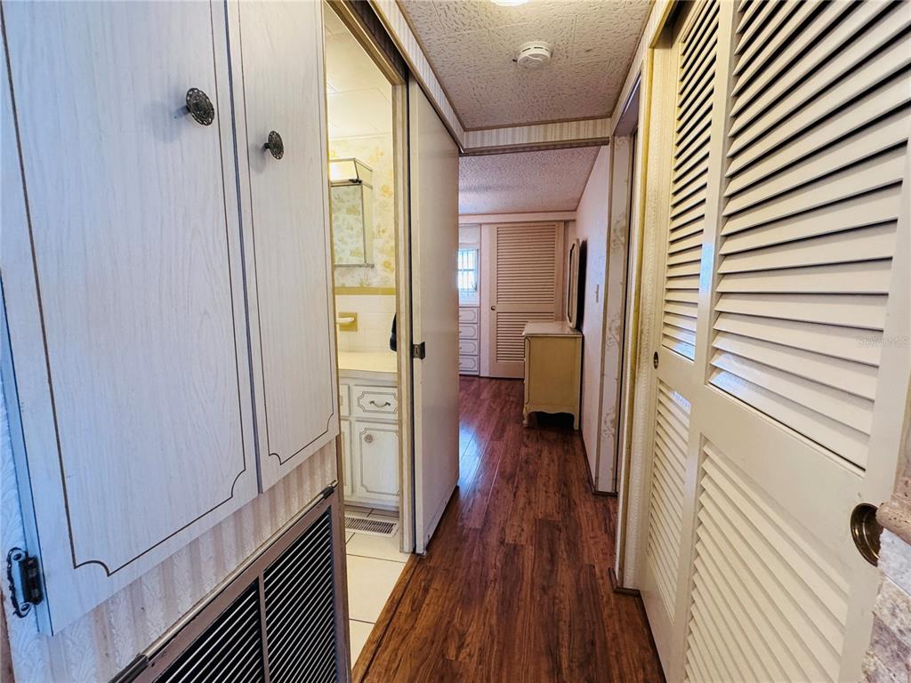 2331 Belleair Road, Unit 715 Clearwater, FL 33764 - Photo 16 of 43 a view of a hallway with wooden floor