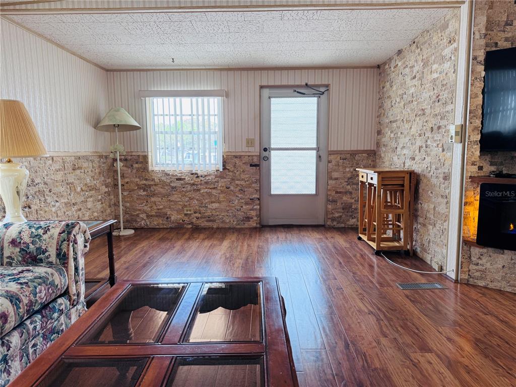 2331 Belleair Road, Unit 715 Clearwater, FL 33764 - Photo 17 of 43 a living room with furniture and a flat screen tv