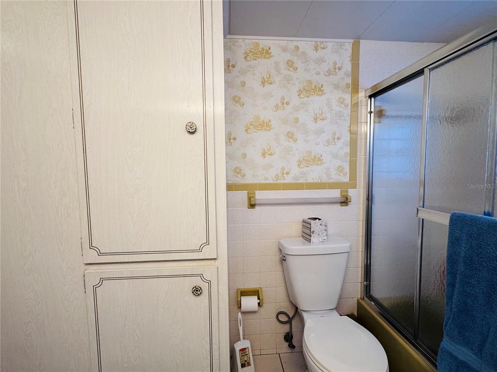 2331 Belleair Road, Unit 715 Clearwater, FL 33764 - Photo 19 of 43 a bathroom with a toilet and a shower