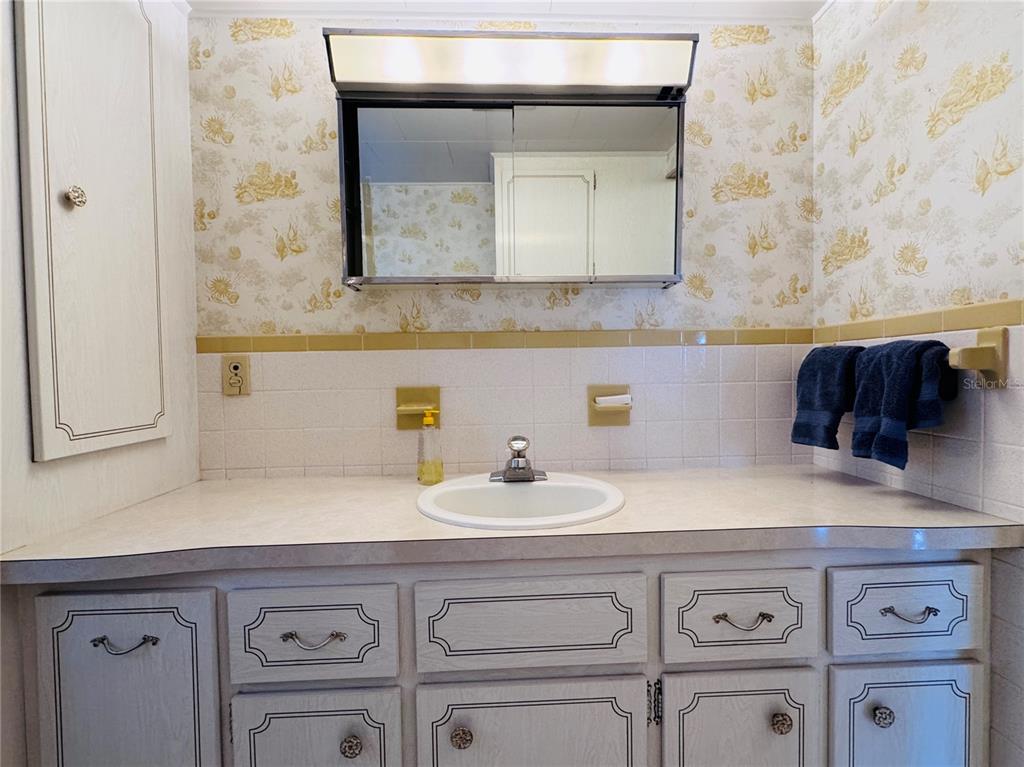 2331 Belleair Road, Unit 715 Clearwater, FL 33764 - Photo 20 of 43 a bathroom with a sink and a mirror