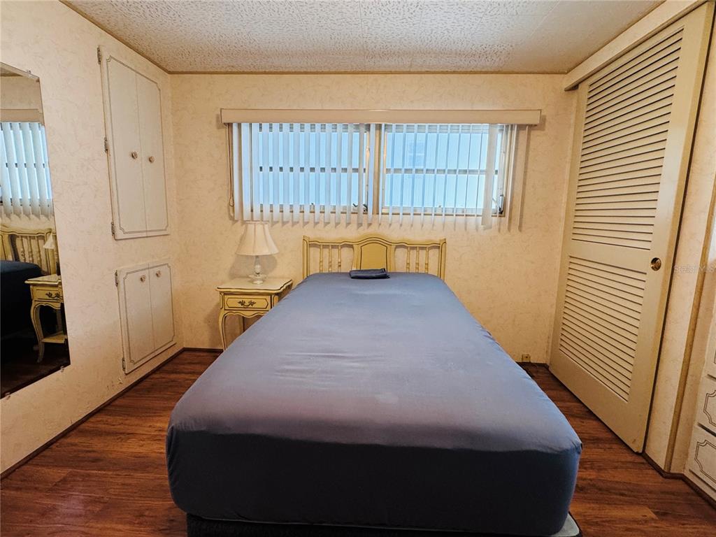 2331 Belleair Road, Unit 715 Clearwater, FL 33764 - Photo 26 of 43 a bed sitting in a bedroom next to a window
