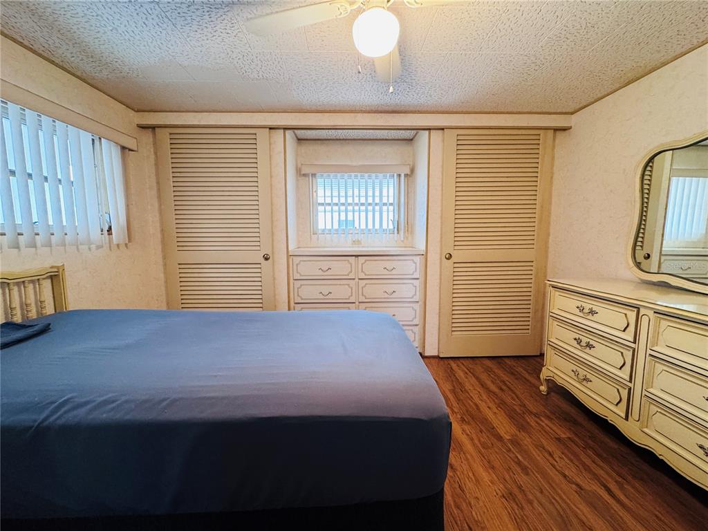 2331 Belleair Road, Unit 715 Clearwater, FL 33764 - Photo 27 of 43 a bedroom with a bed dresser and a window