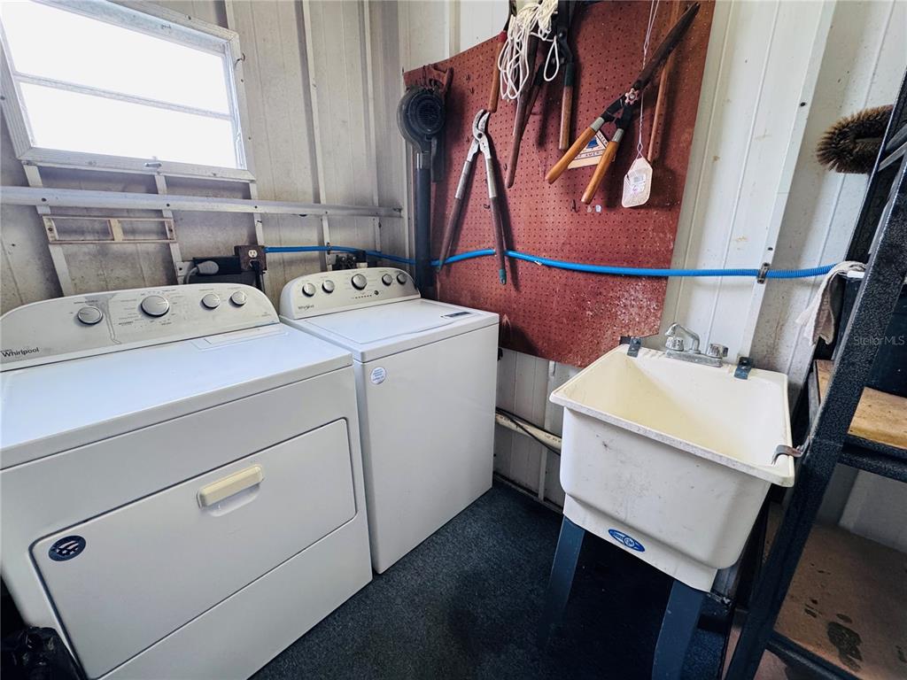 2331 Belleair Road, Unit 715 Clearwater, FL 33764 - Photo 33 of 43 a utility room with dryer and washer