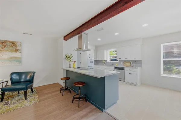 a kitchen with a sink cabinets and window