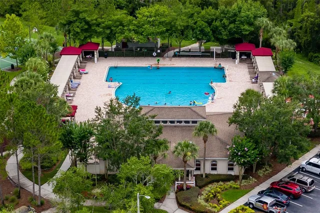 an aerial view of a house with outdoor space