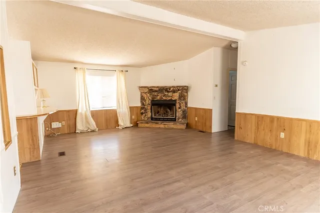 a view of living room with furniture and a fireplace