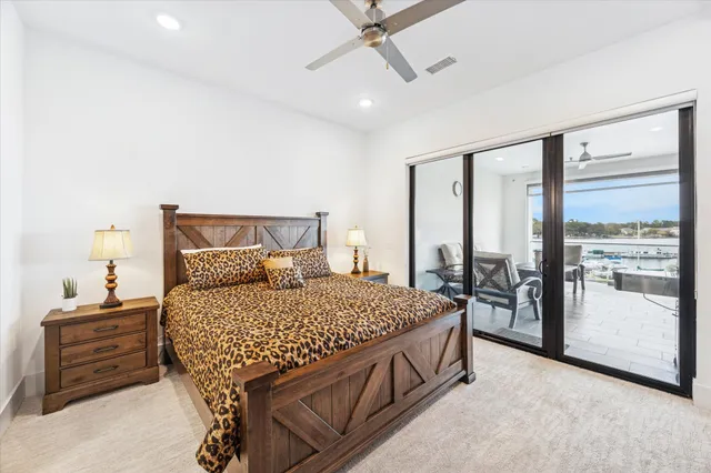 a bedroom with a bed and cabinets