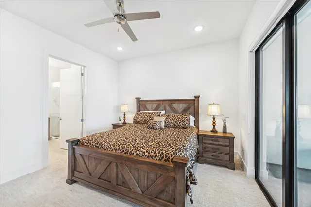 a bathroom with a granite countertop sink a mirror and shower