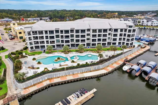 an aerial view of a swimming pool and outdoor space