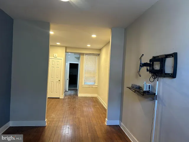 a room with a table and potted plants