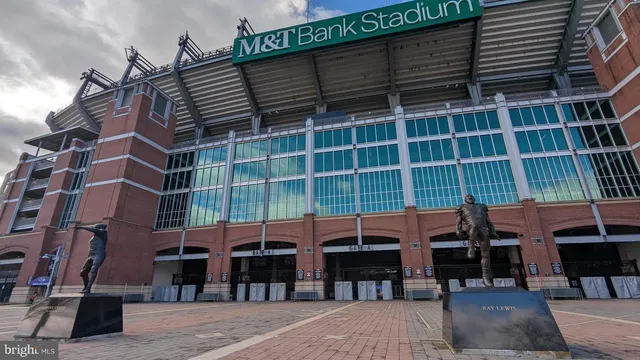 a kitchen with stainless steel appliances granite countertop a refrigerator stove and microwave