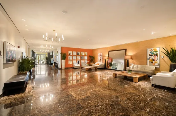 a view of a living room and kitchen floor to ceiling window and kitchen view
