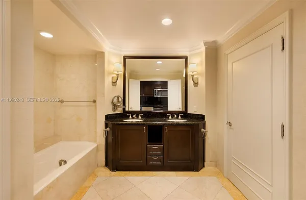 a living room with a stove and a refrigerator