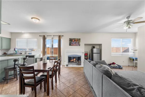 a large kitchen with cabinets table and chairs