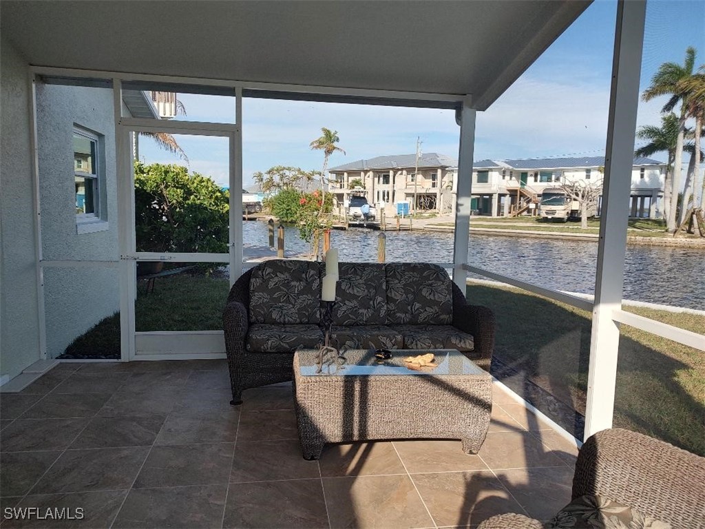 2585 Third Street Matlacha, FL 33993 - Photo 14 of 16 a living room with furniture and potted plants