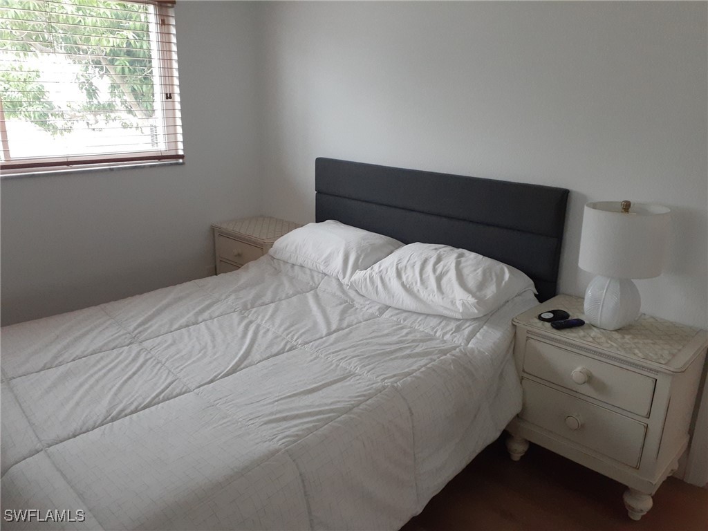 2585 Third Street Matlacha, FL 33993 - Photo 10 of 16 a bedroom with a bed and a window