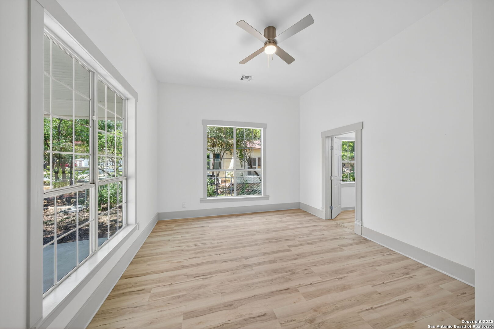 904 17th Street Hondo, TX 78861 - Photo 16 of 31 a view of empty room with wooden floor and fan
