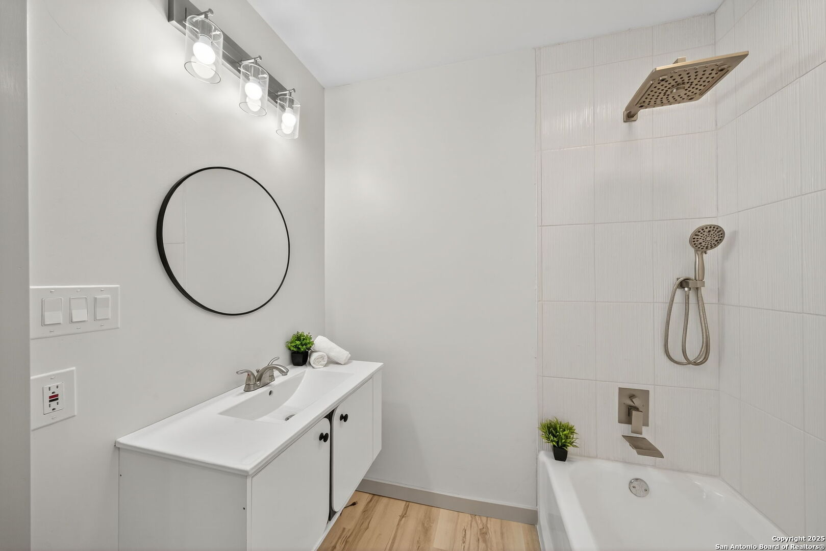 904 17th Street Hondo, TX 78861 - Photo 23 of 31 a bathroom with a sink a toilet and shower