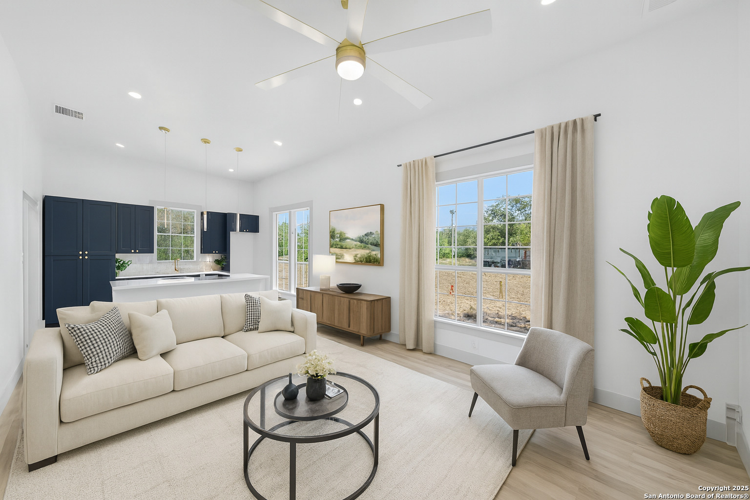 904 17th Street Hondo, TX 78861 - Photo 3 of 31 a living room with furniture potted plant and a window