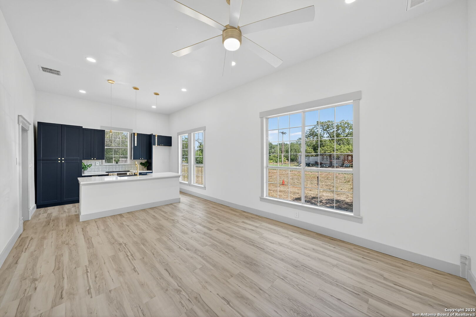 904 17th Street Hondo, TX 78861 - Photo 6 of 31 a view of kitchen with cabinets and wooden floor
