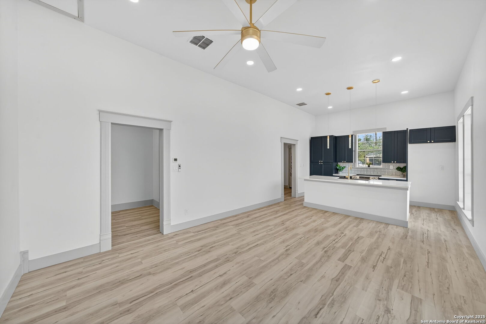 904 17th Street Hondo, TX 78861 - Photo 7 of 31 a view of kitchen with wooden floor and window
