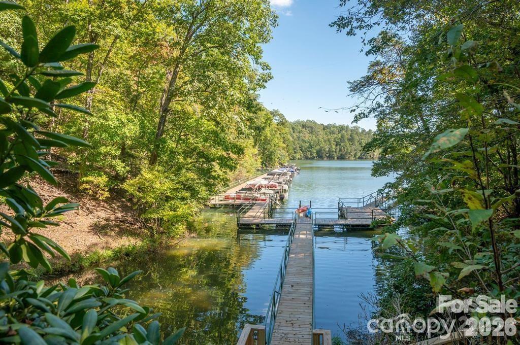 26 Mountain Parkway, Unit 26 Mill Spring, NC 28756 - Photo 4 of 7 a view of a lake with a building in the background