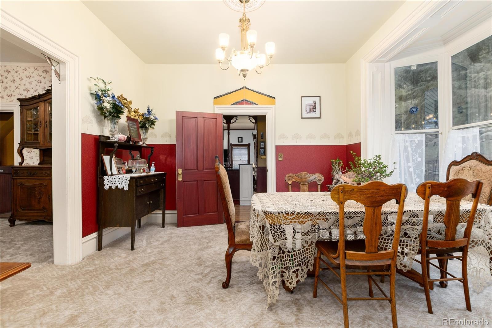 200 Rose Street Georgetown, CO 80444 - Photo 12 of 43 a view of a dining room with furniture and chandelier